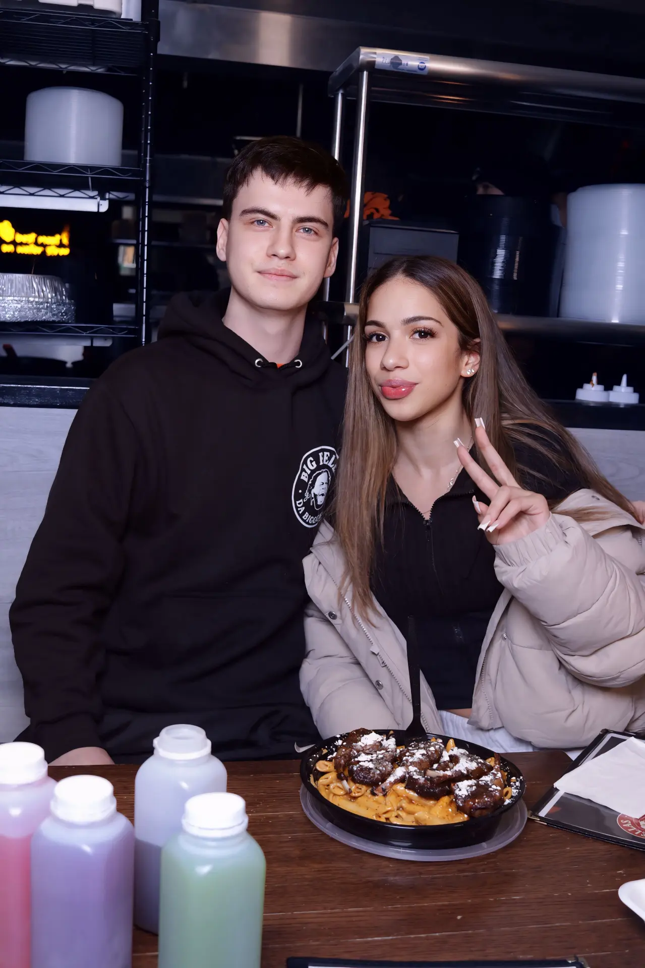 Two guests at a table with dessert and drinks