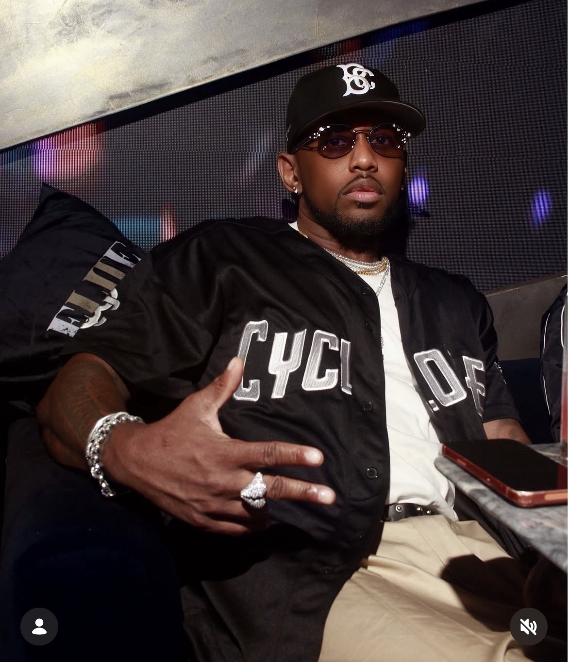 Guest seated in a lounge booth at a night venue